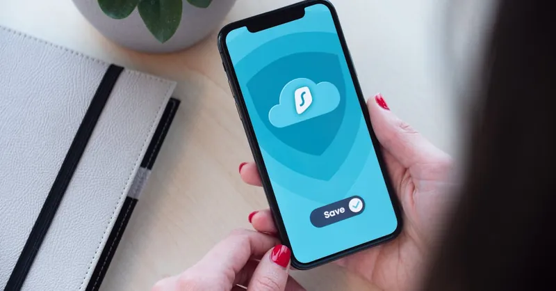 Woman using a secure mobile app, showcasing data encryption on a smartphone.