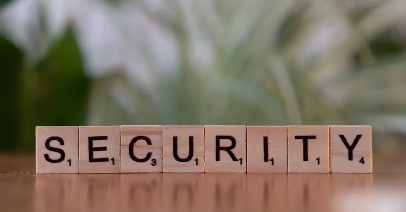 Close-up of wooden Scrabble tiles spelling SECURITY, symbolizing cybersecurity and protection.